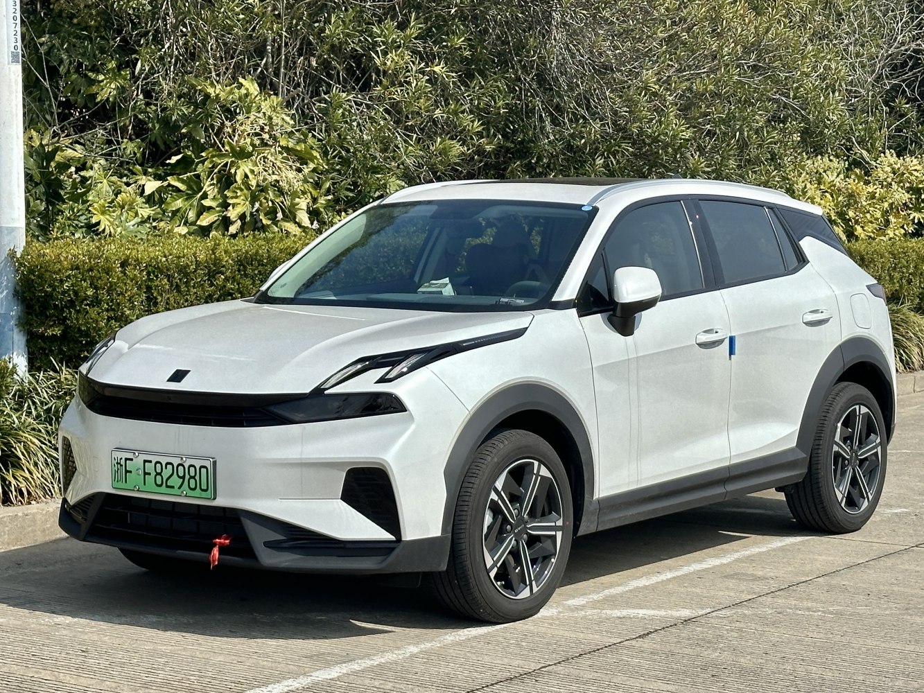 Front-side view with sleek headlights and aerodynamic design