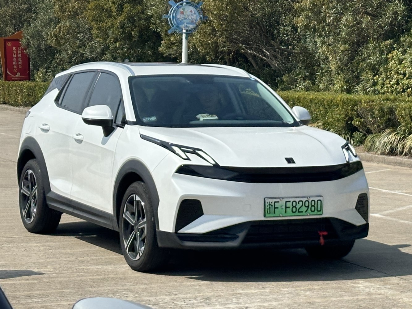 Modern white SUV with sharp LED headlights and black trim