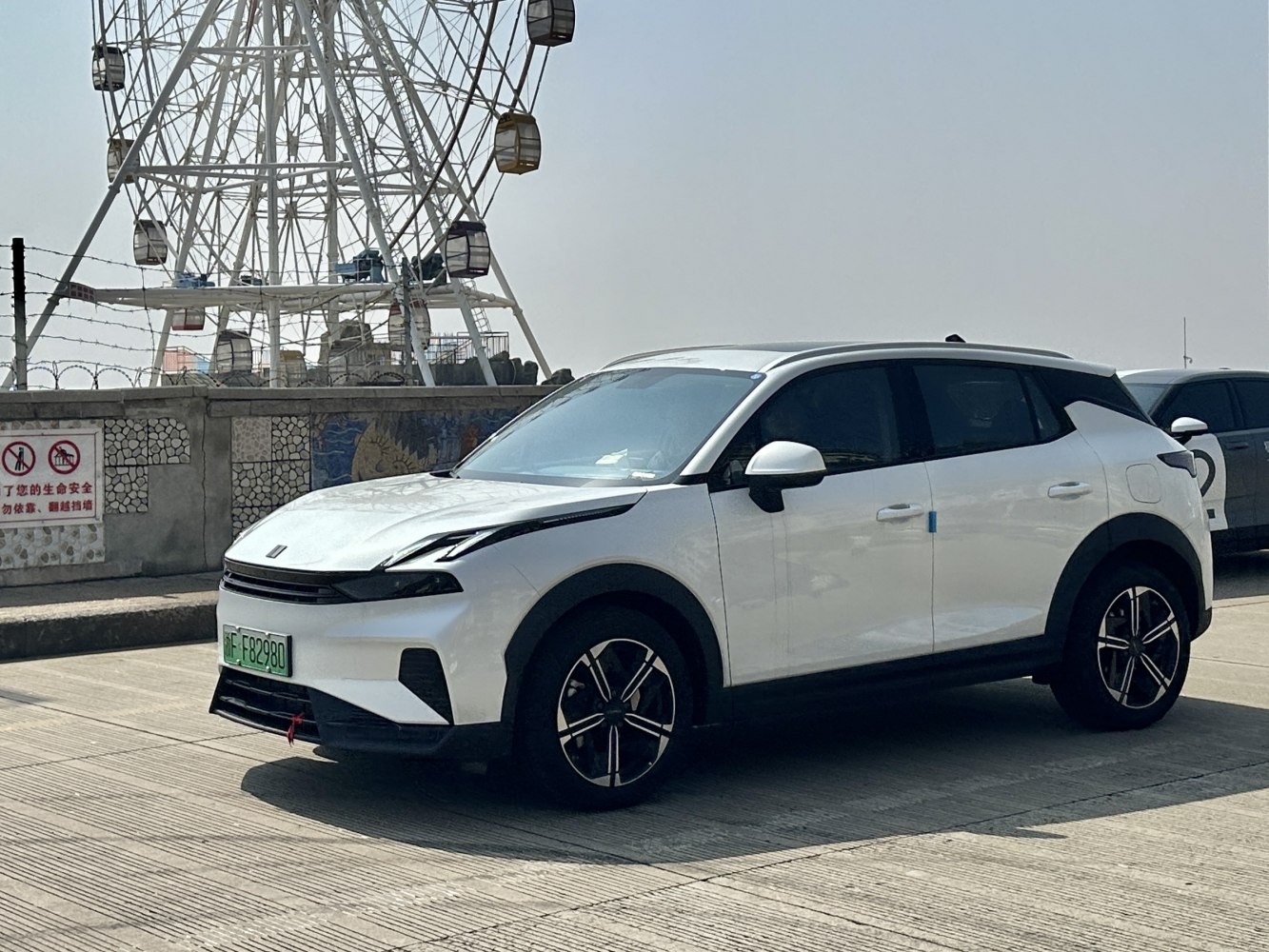 Front side view with sporty alloy wheels and sleek LED headlights
