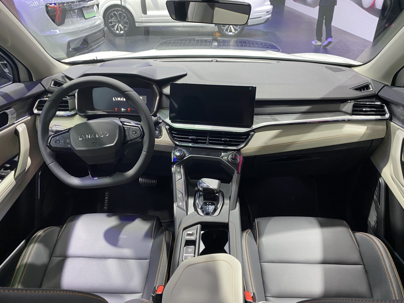 Digital dashboard and touchscreen center console with ergonomic steering wheel.