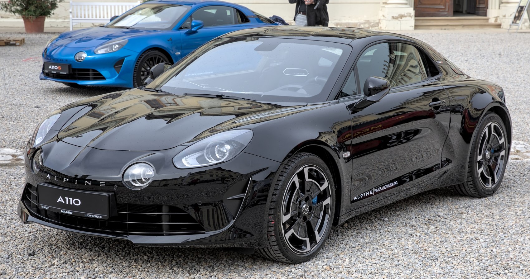 Close-up of coupe front headlights and aerodynamic side profile