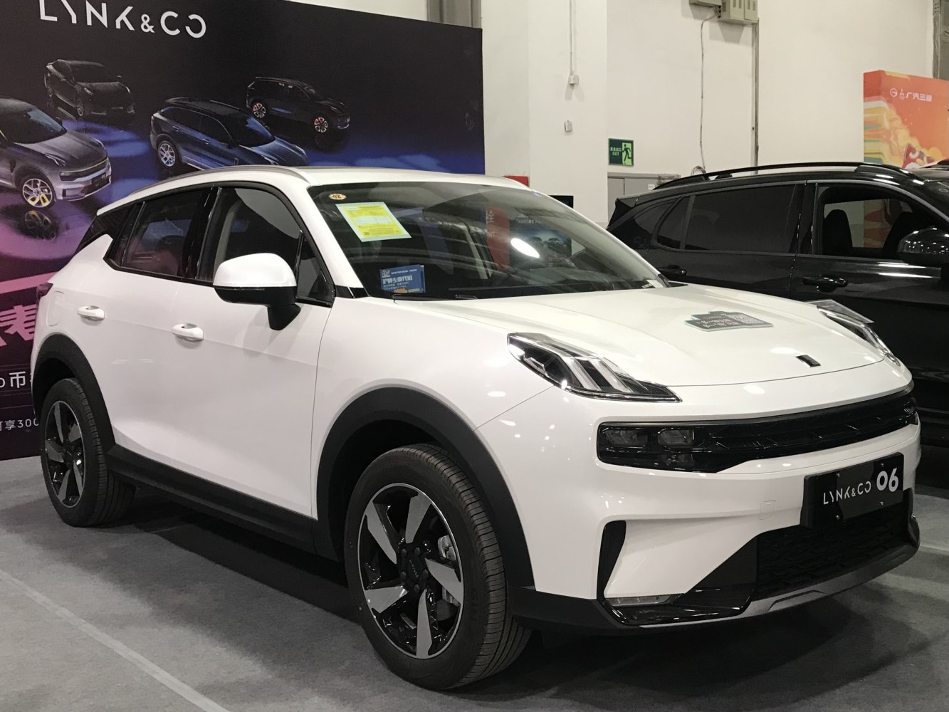 Front-side view of white crossover with LED headlights