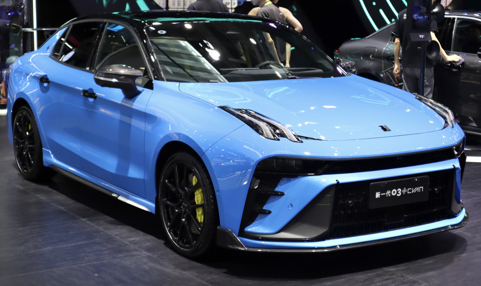 Sporty sedan with aggressive front fascia and black alloy wheels