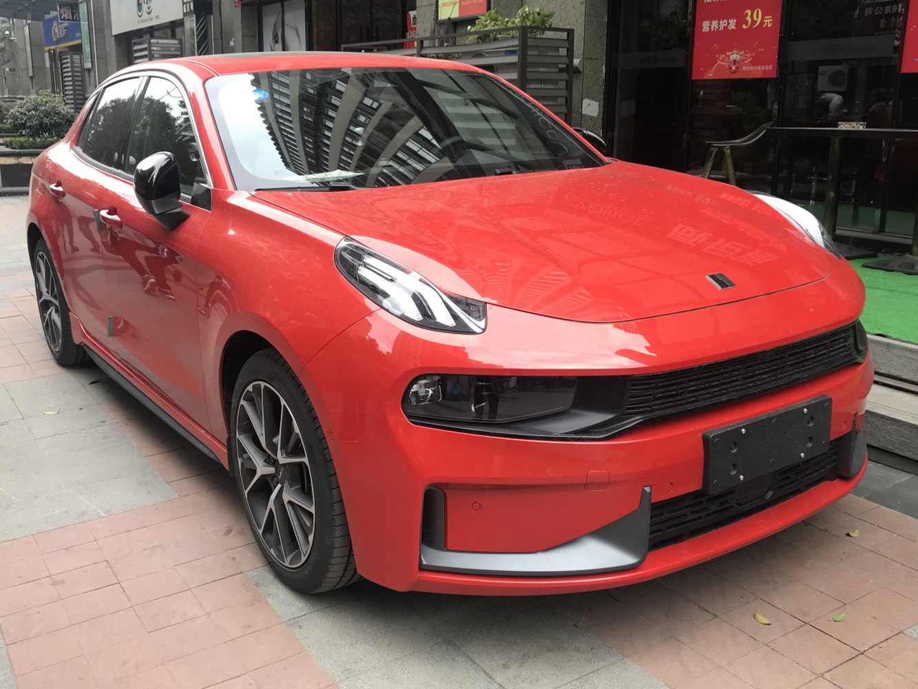 Front view featuring LED headlights and sporty grille