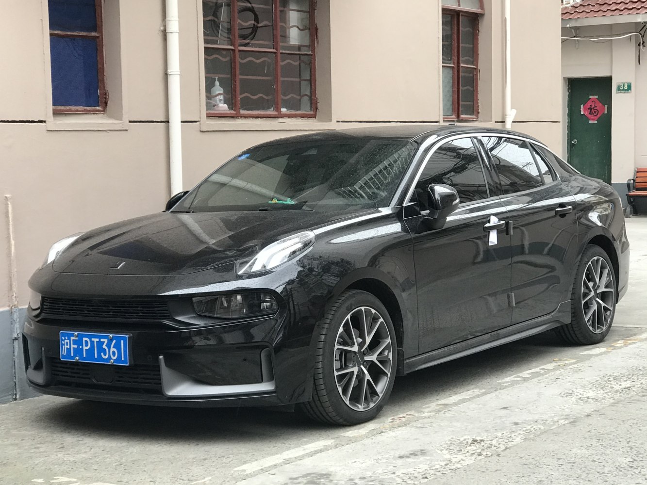 Black sedan with unique headlights and sporty alloy wheels