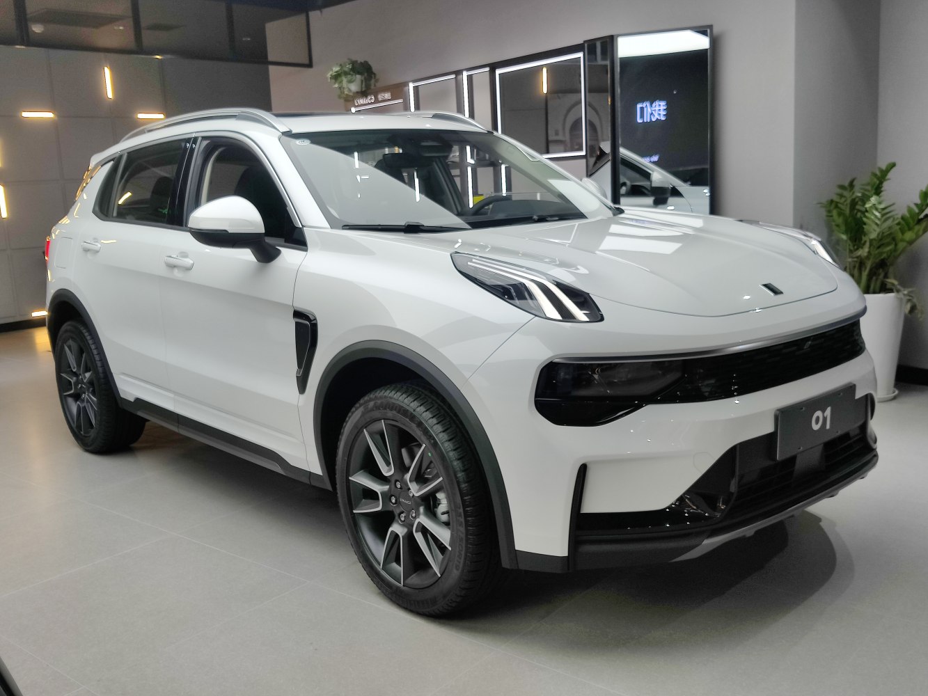 Front side view of modern SUV with LED headlights and alloy wheels