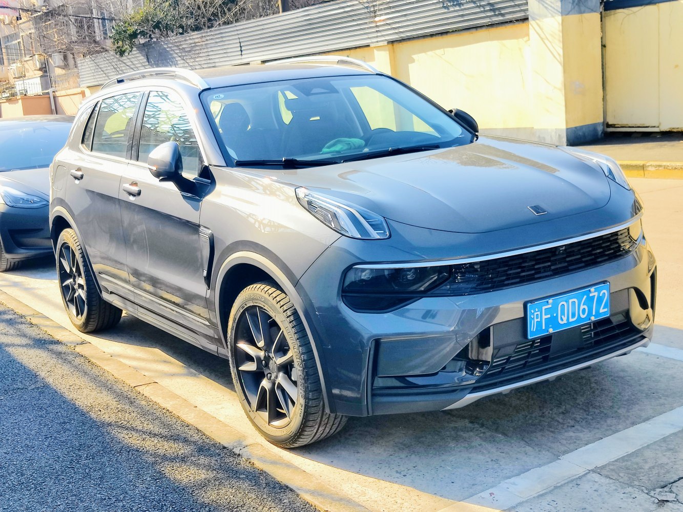 Front fascia and side profile of a modern SUV with sleek headlights and aerodynamic design