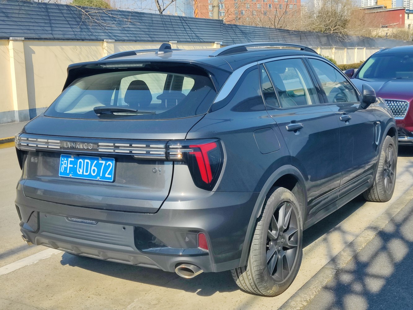 Rear profile with updated taillights and dual exhaust pipes.