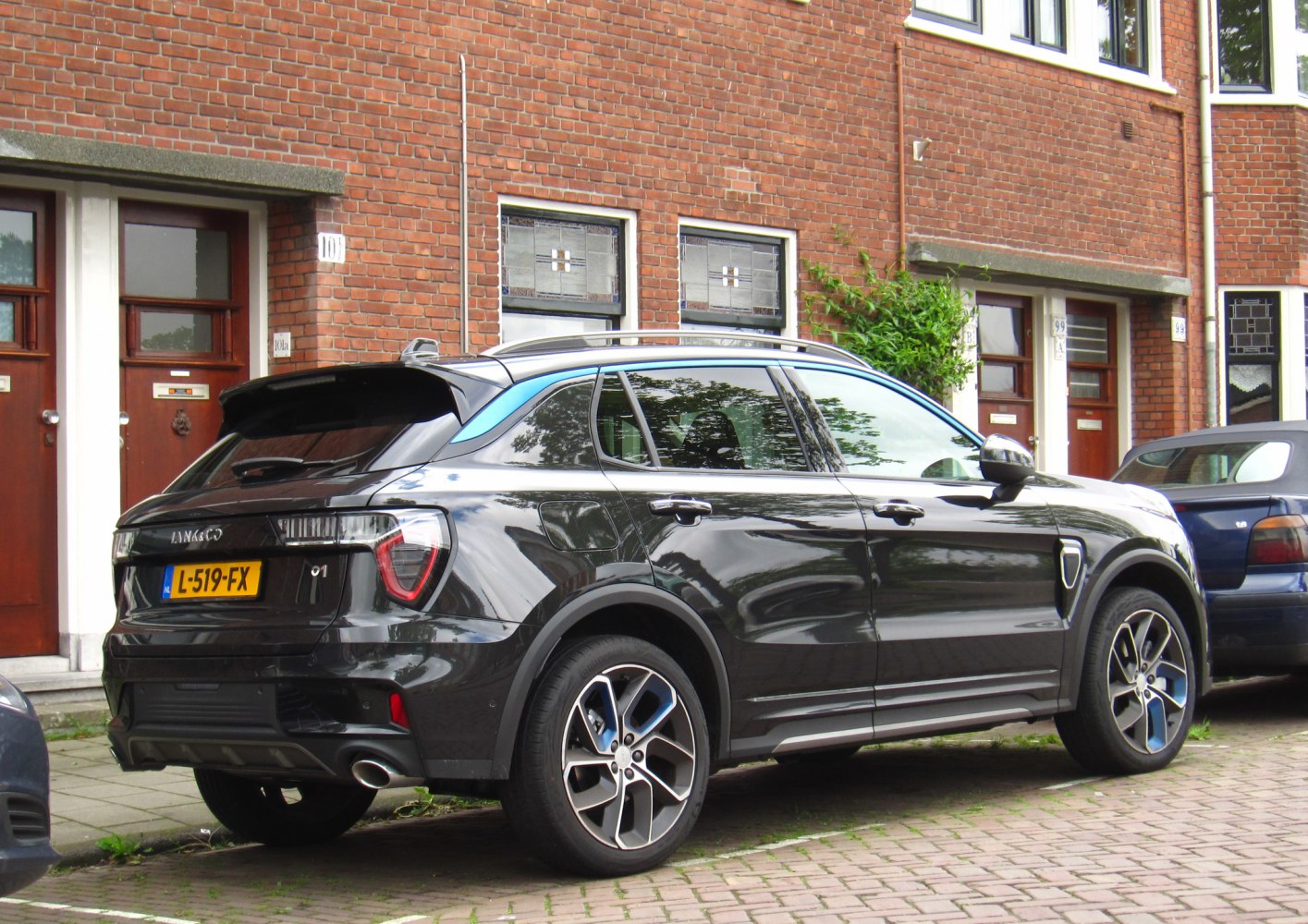 Rear and side exterior of a modern SUV with distinctive taillights and alloy wheels