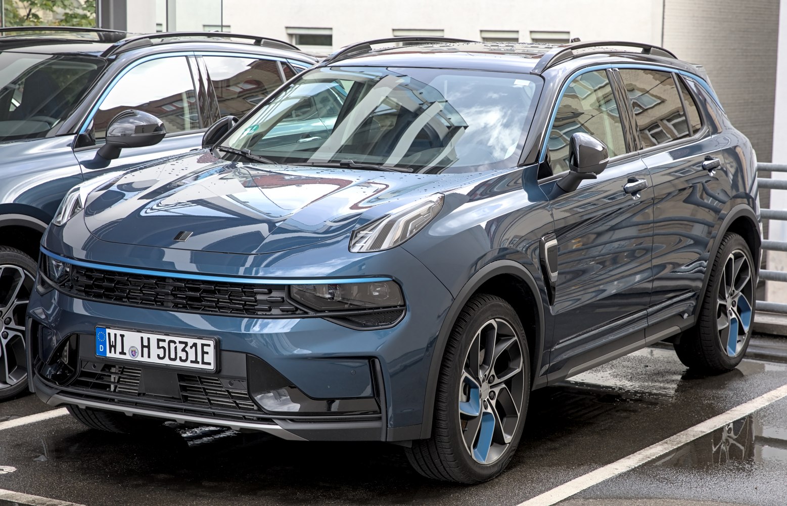Front grille, modern headlights, unique alloy wheels on urban SUV