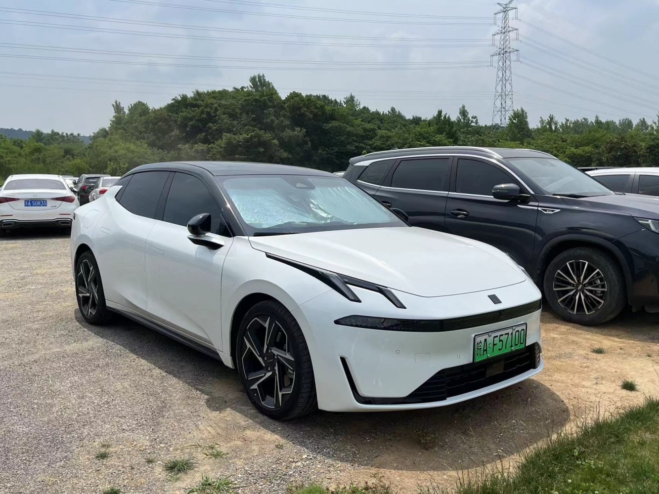 Sleek front profile with distinctive dual LED headlights and aerodynamic design