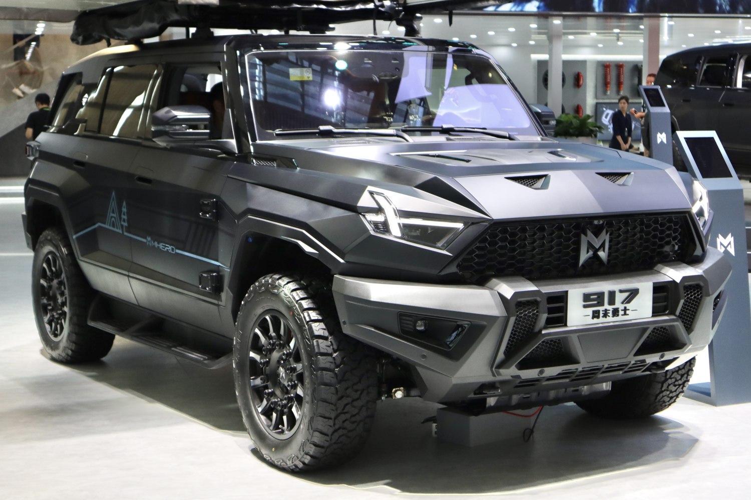Angular rugged SUV front with LED headlights and off-road tires