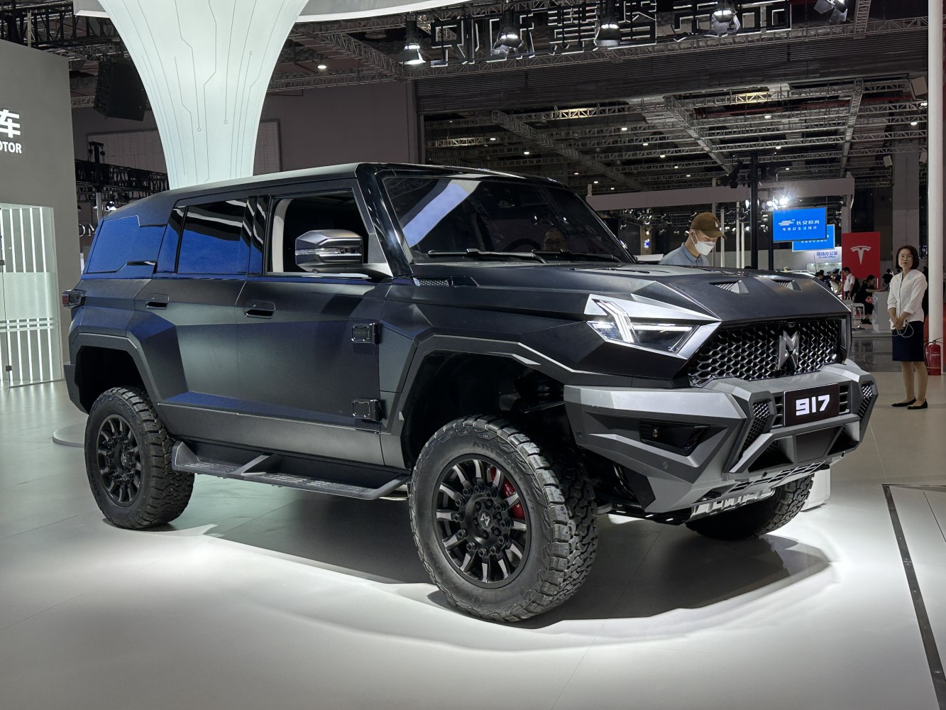 Aggressive SUV front design with rugged tires and angular body panels