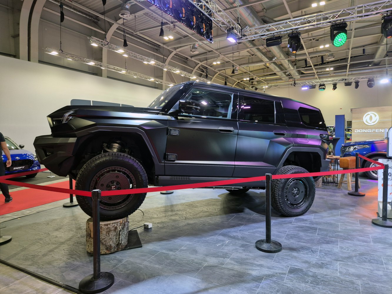 Angular matte black SUV with high ground clearance and large off-road tires