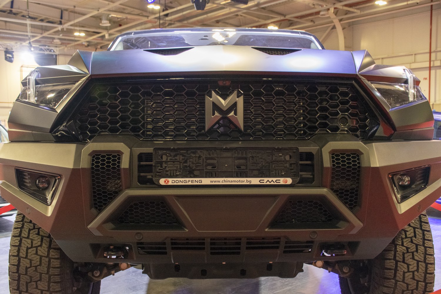 Bold hexagonal grille and angular headlights at front view