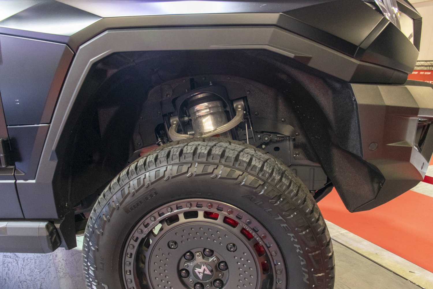 Front wheel suspension and rugged all-terrain tire close-up