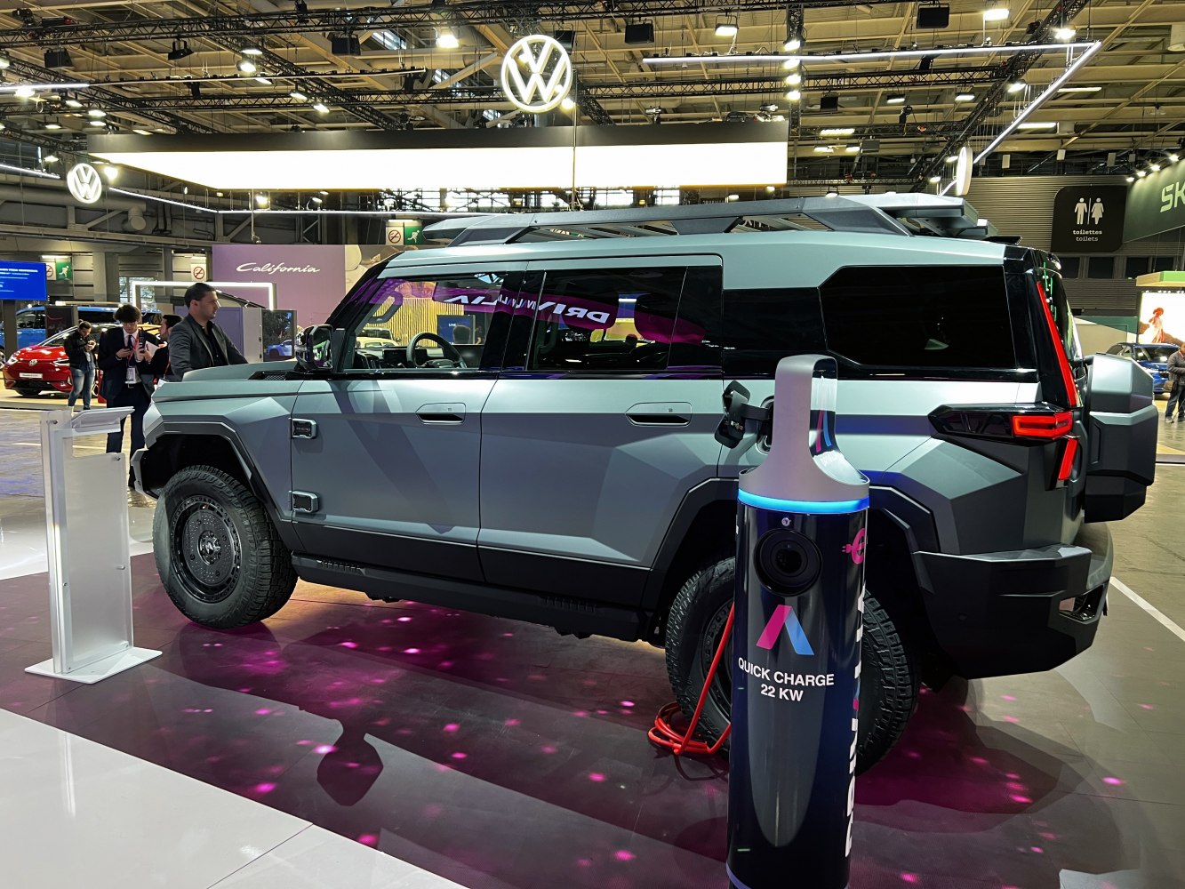 Rugged angular electric SUV with 22kW quick charge station