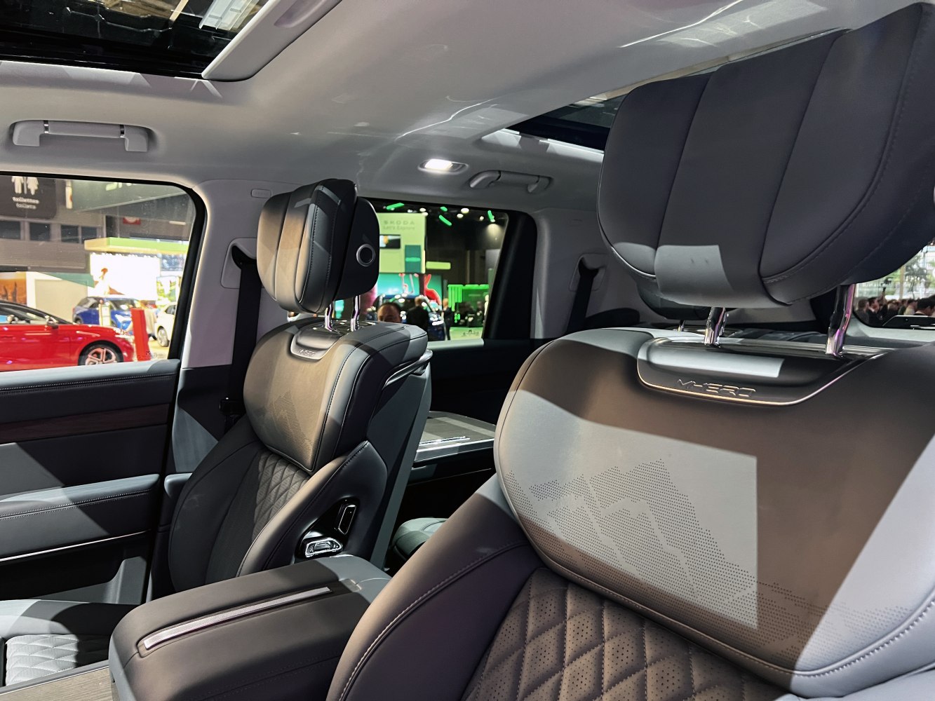 Luxurious leather front seats with detailed stitching and panoramic sunroof