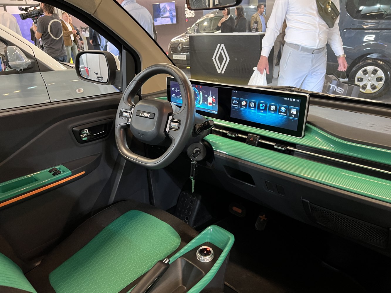 Modern interior with digital instrument cluster and touchscreen infotainment.