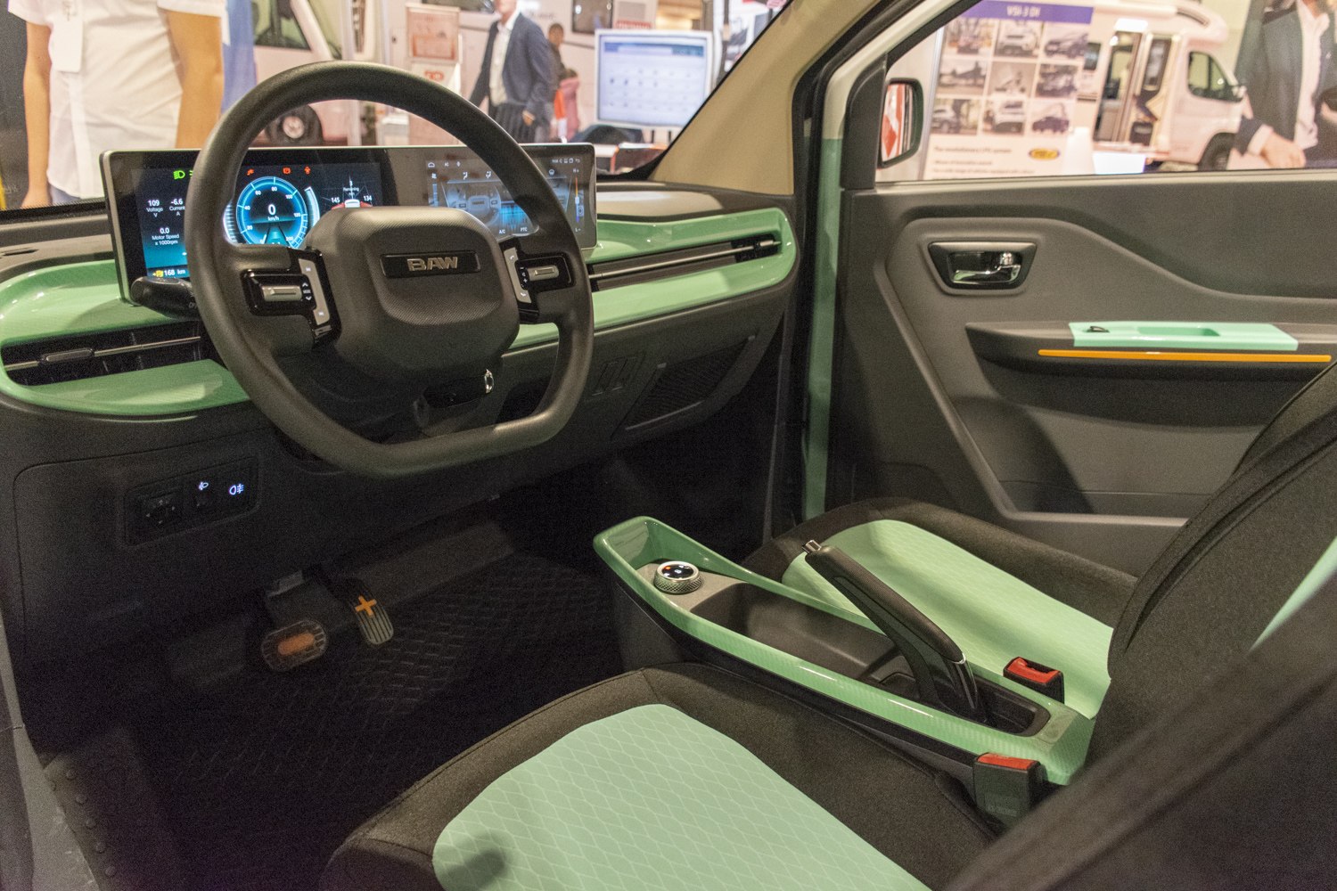 Modern digital dashboard and mint-accented car interior