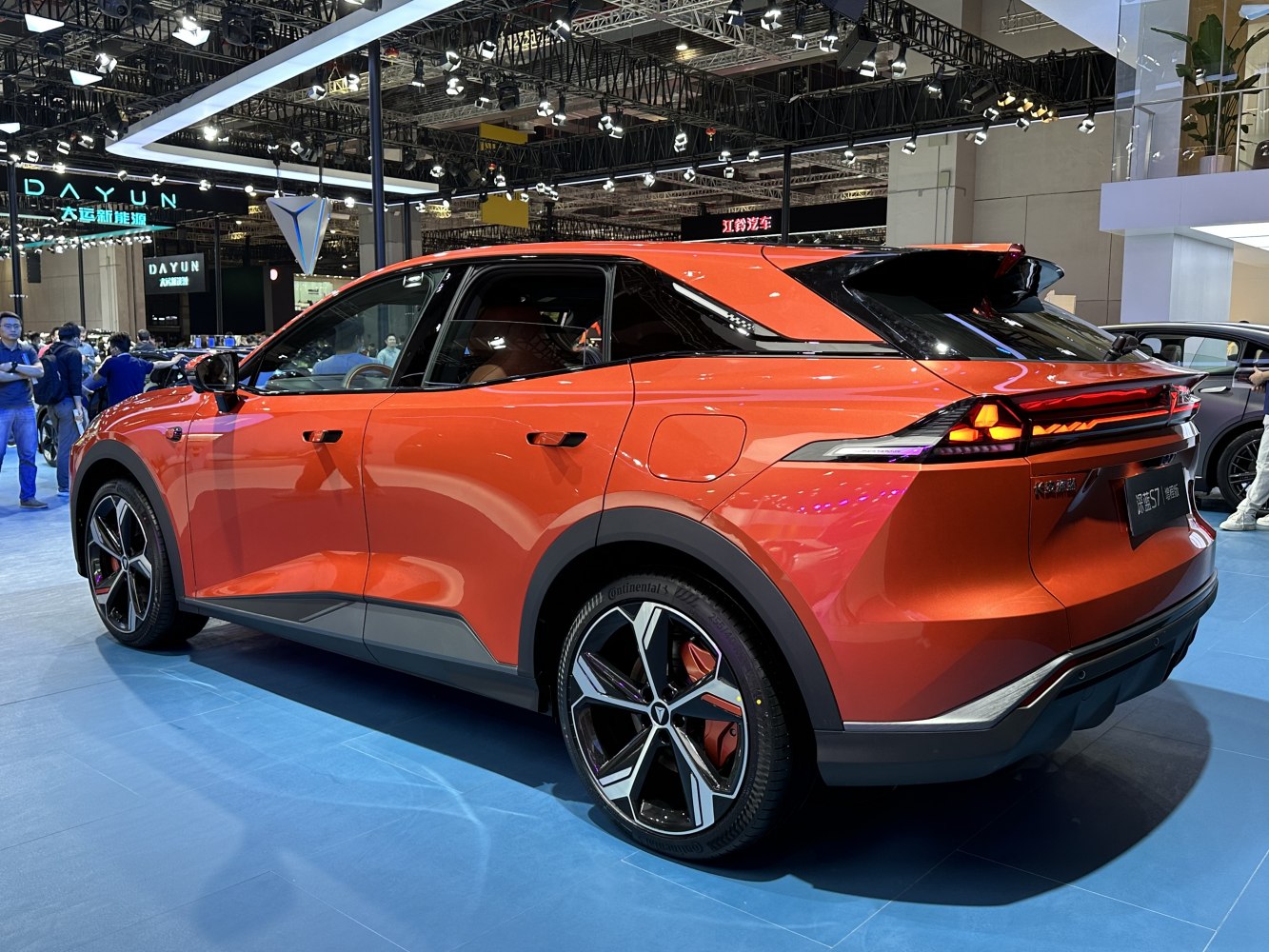 Orange angular rear design with modern taillights and alloy wheels