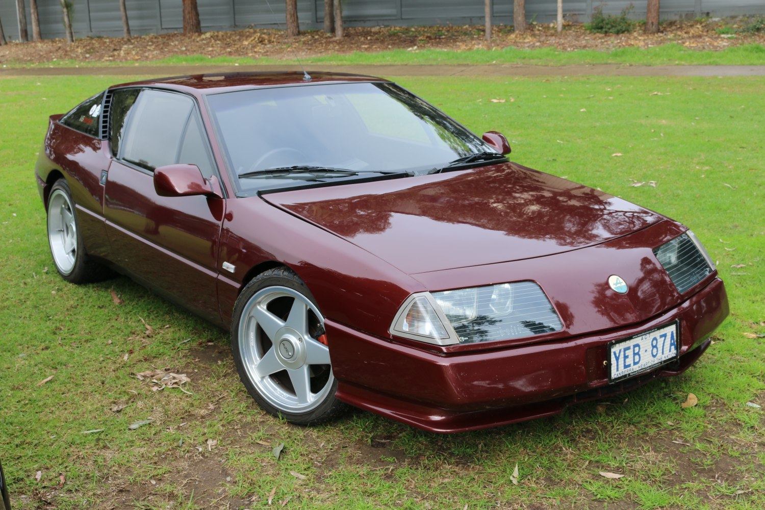 Front view with distinctive headlights and alloy wheels