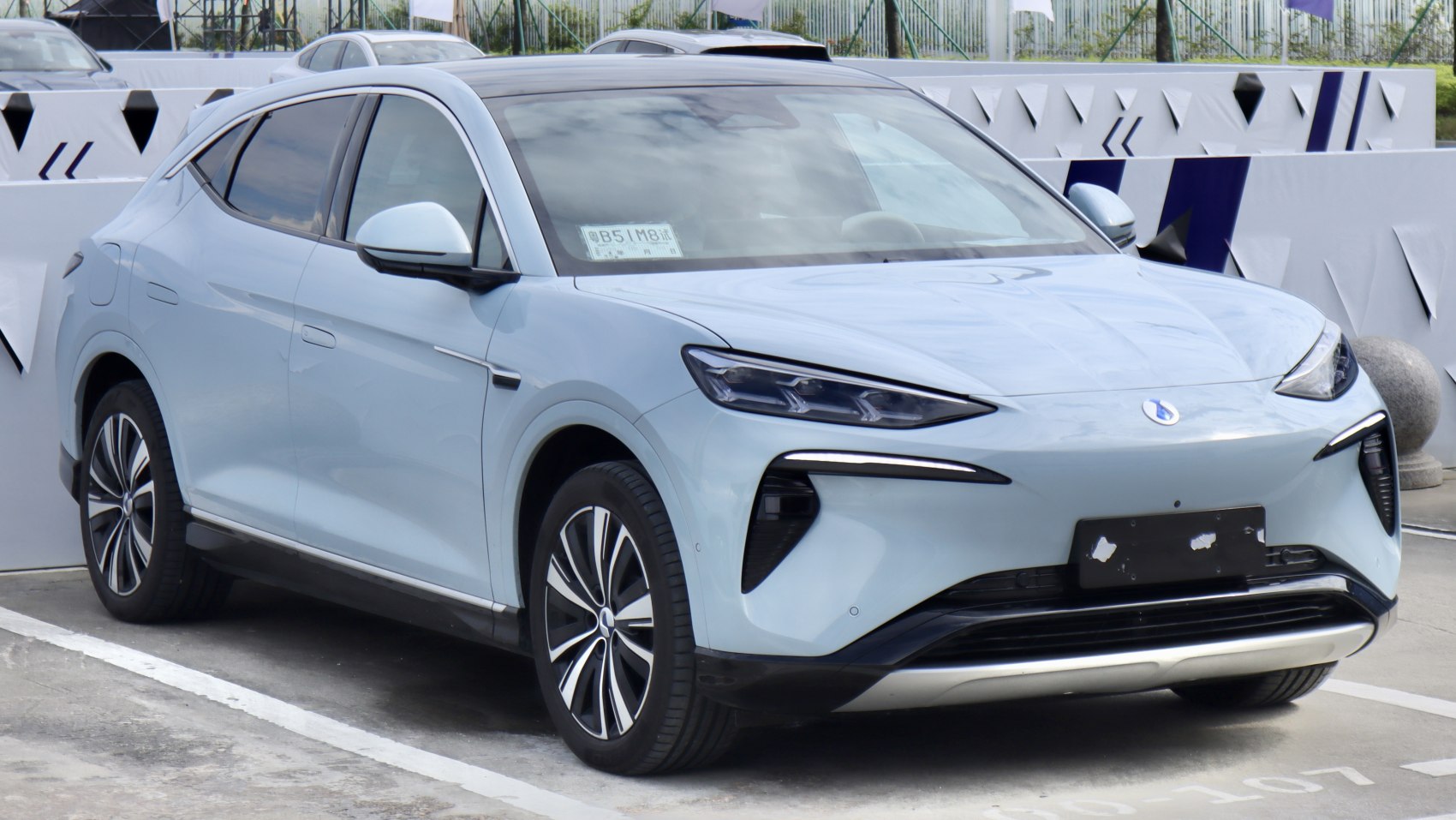 Front and side view of modern electric SUV with LED headlights