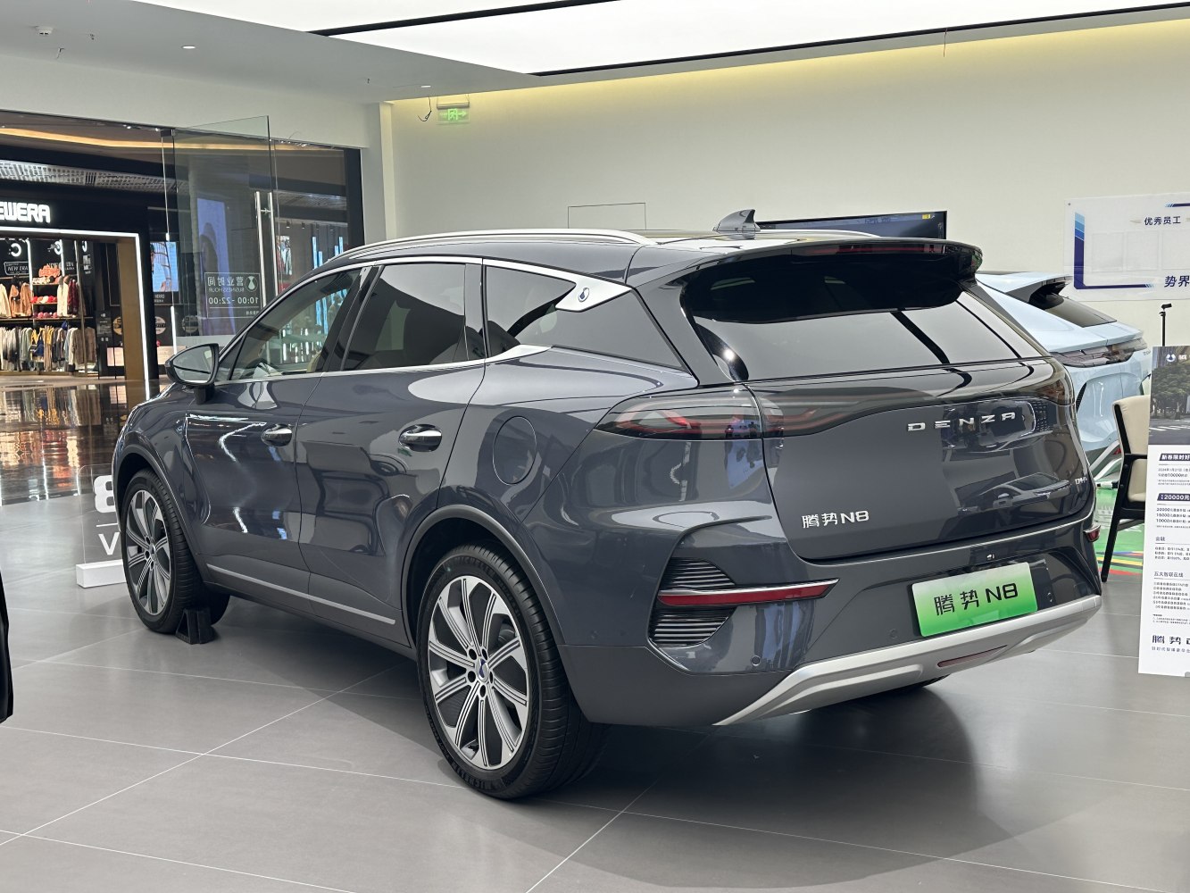 Sleek rear and side profile with modern taillights and rear spoiler