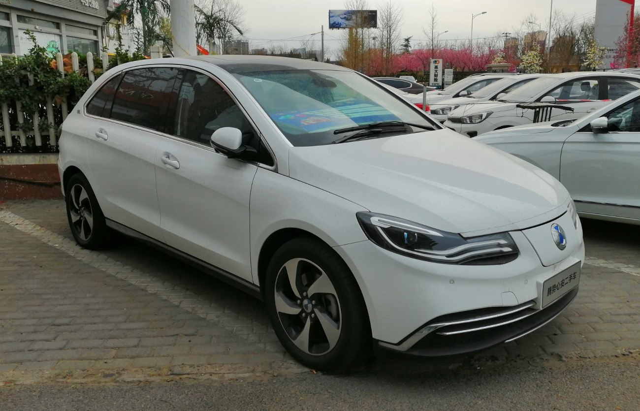 Front and side view of an electric hatchback with LED headlights and aerodynamic wheels