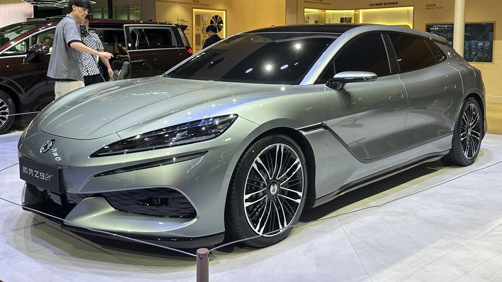Sleek silver hatchback with aerodynamic styling and multi-spoke wheels