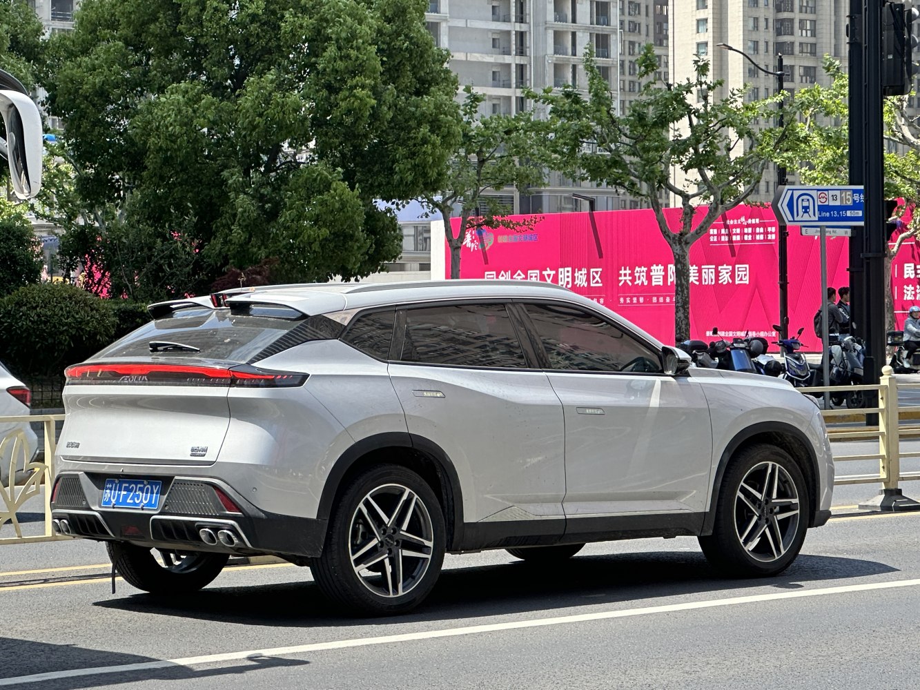 Sleek SUV rear side with quad exhaust pipes