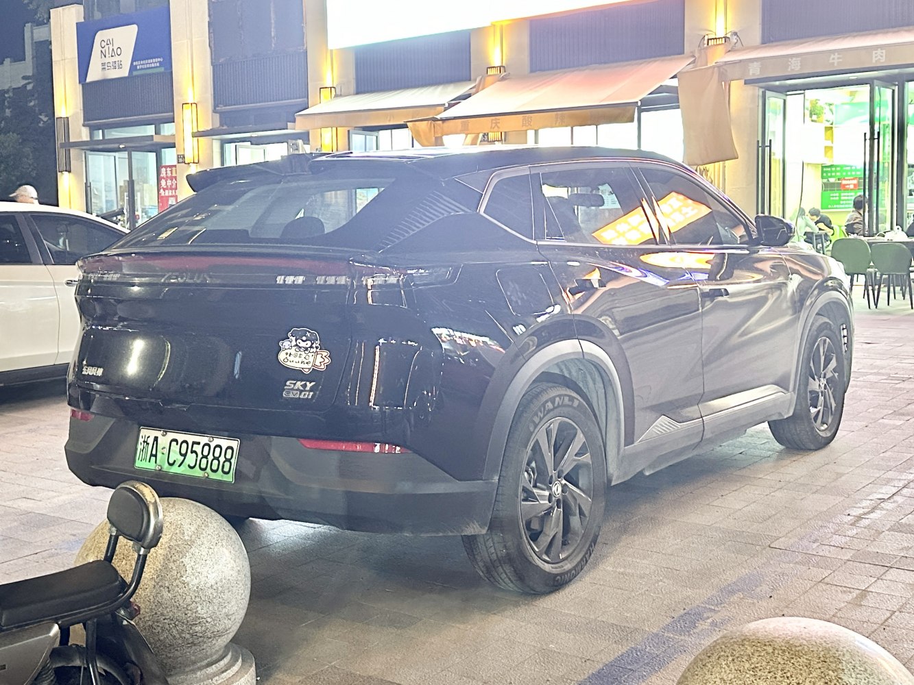 Rear and side view of electric SUV with alloy wheels