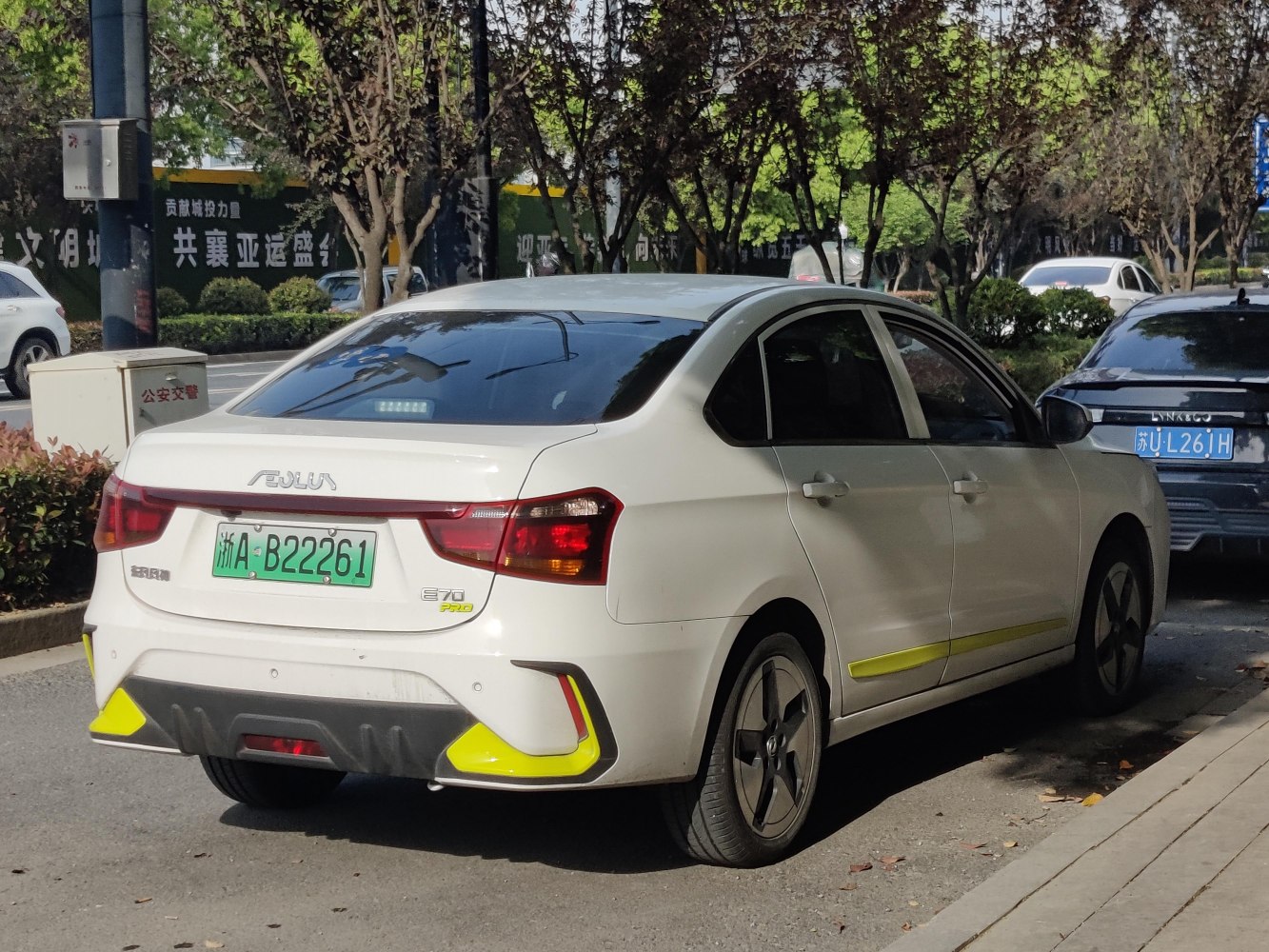 Rear and side view of a modern sedan with distinct taillights and sleek design.