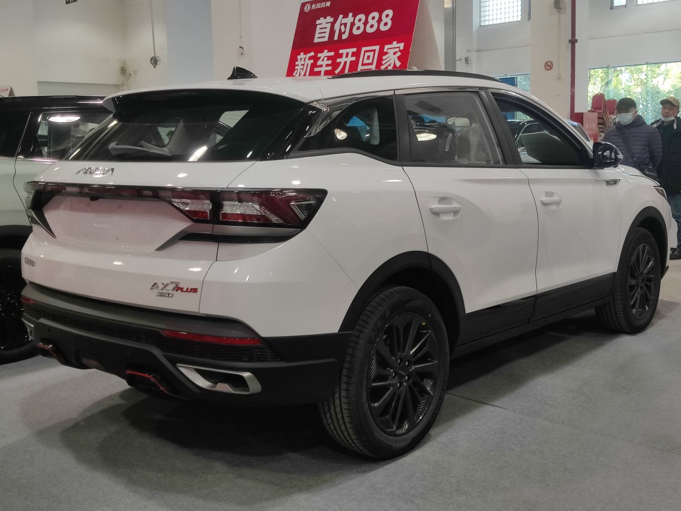Rear and side view with distinctive tail lights and alloy wheels