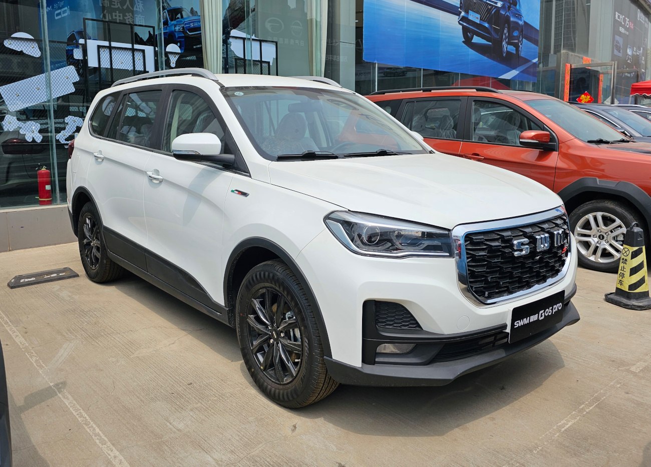 White SUV front three-quarter view with modern headlights and black grille