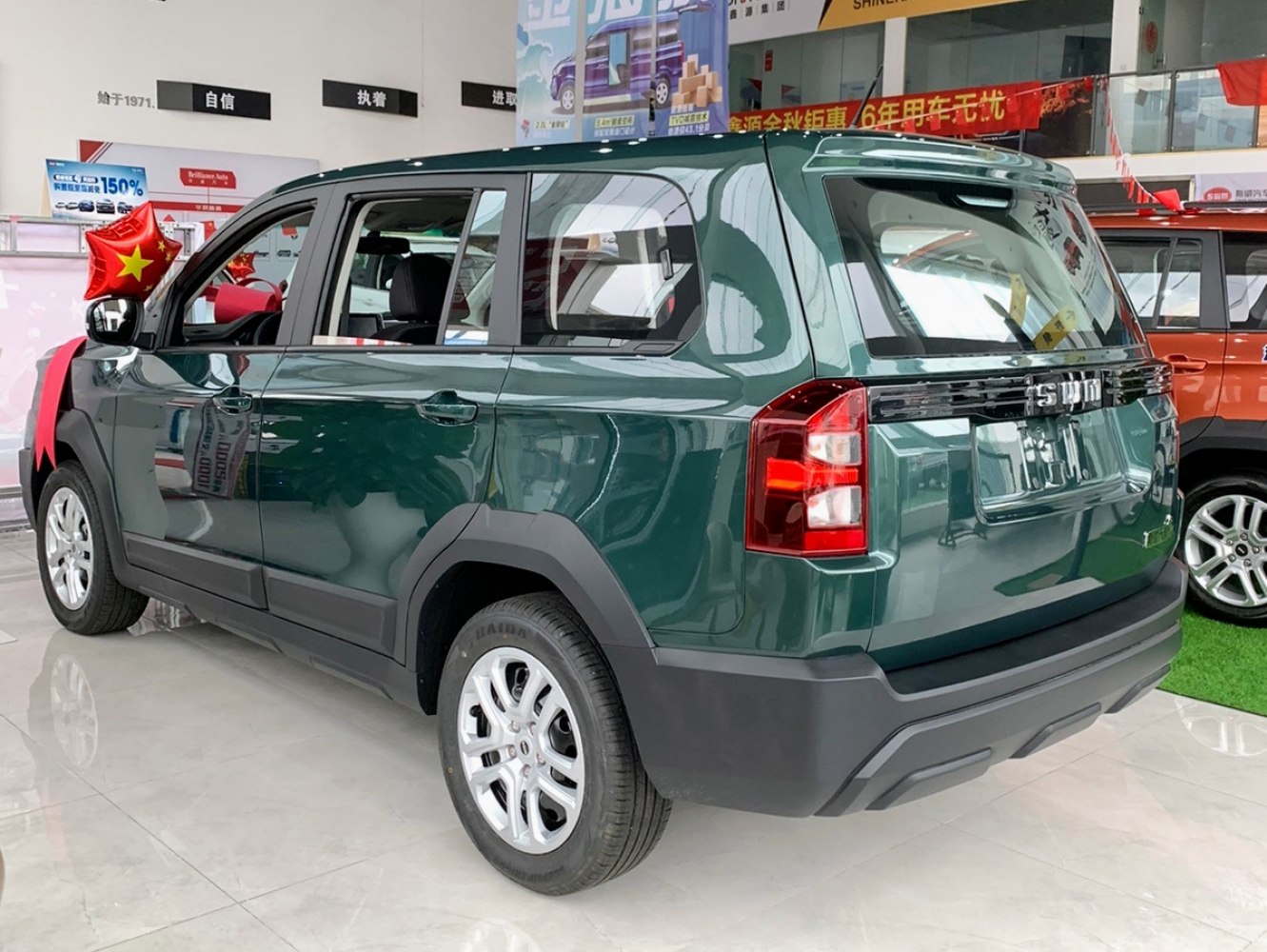 Boxy SUV rear and side with distinctive taillights and black cladding