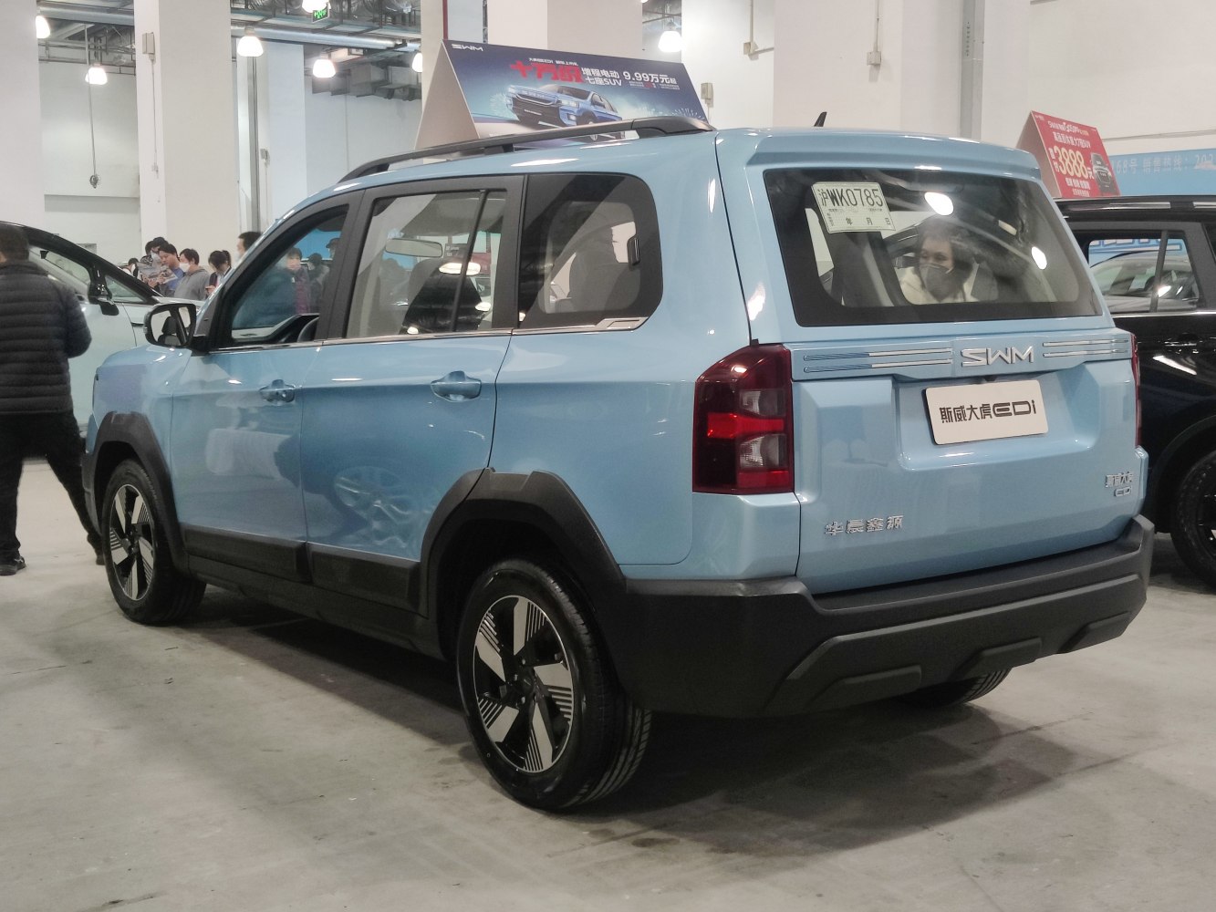 Rear and side view of SUV with alloy wheels and boxy shape