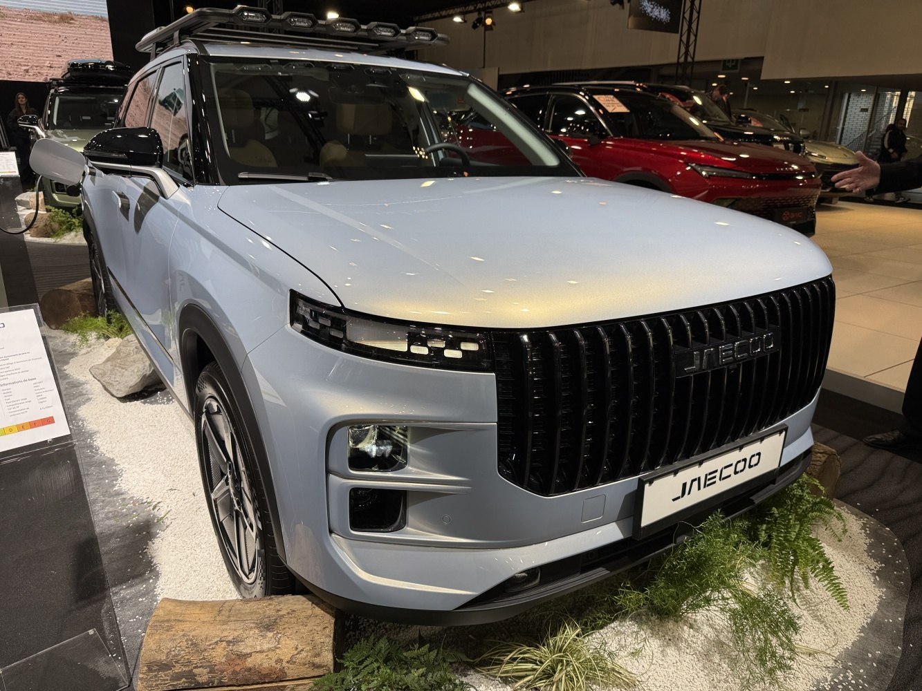 Front view of modern SUV with black grille and LED headlights
