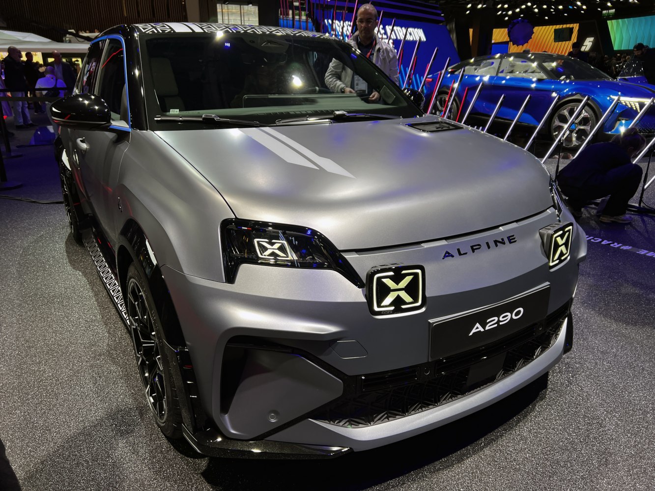 Front view of SUV with unique X-shaped LED headlights and sporty modern design.