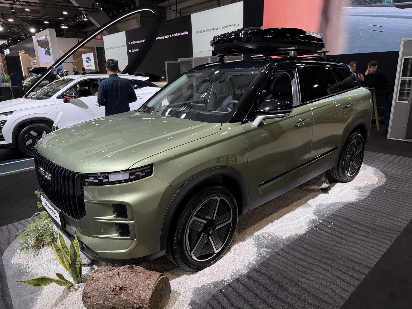 SUV with roof cargo box and sleek LED headlights