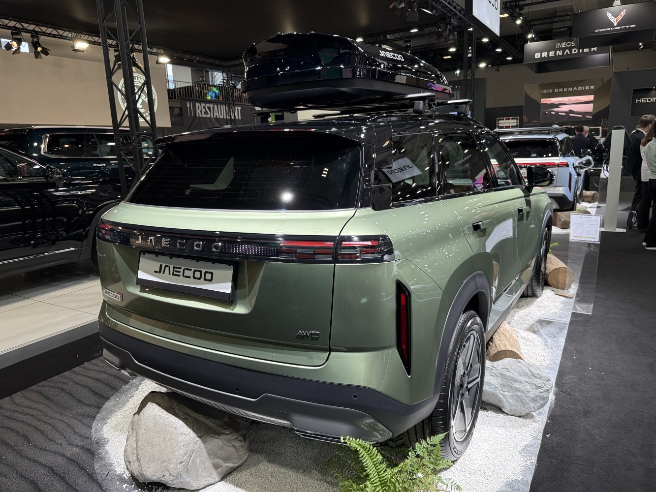 Rear view of AWD SUV with roof-mounted cargo box and modern tail light design