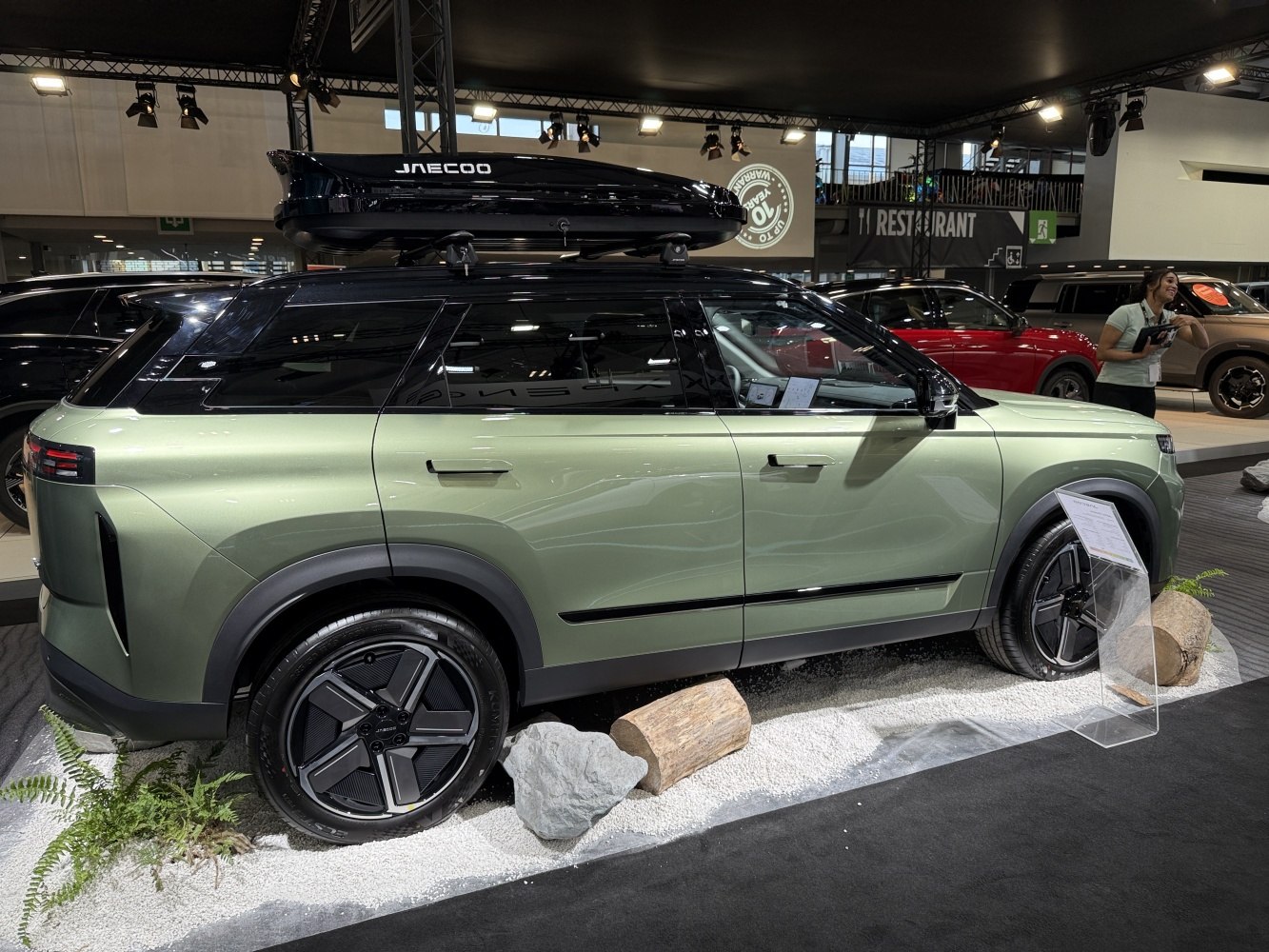 SUV with roof cargo box and modern alloy wheels