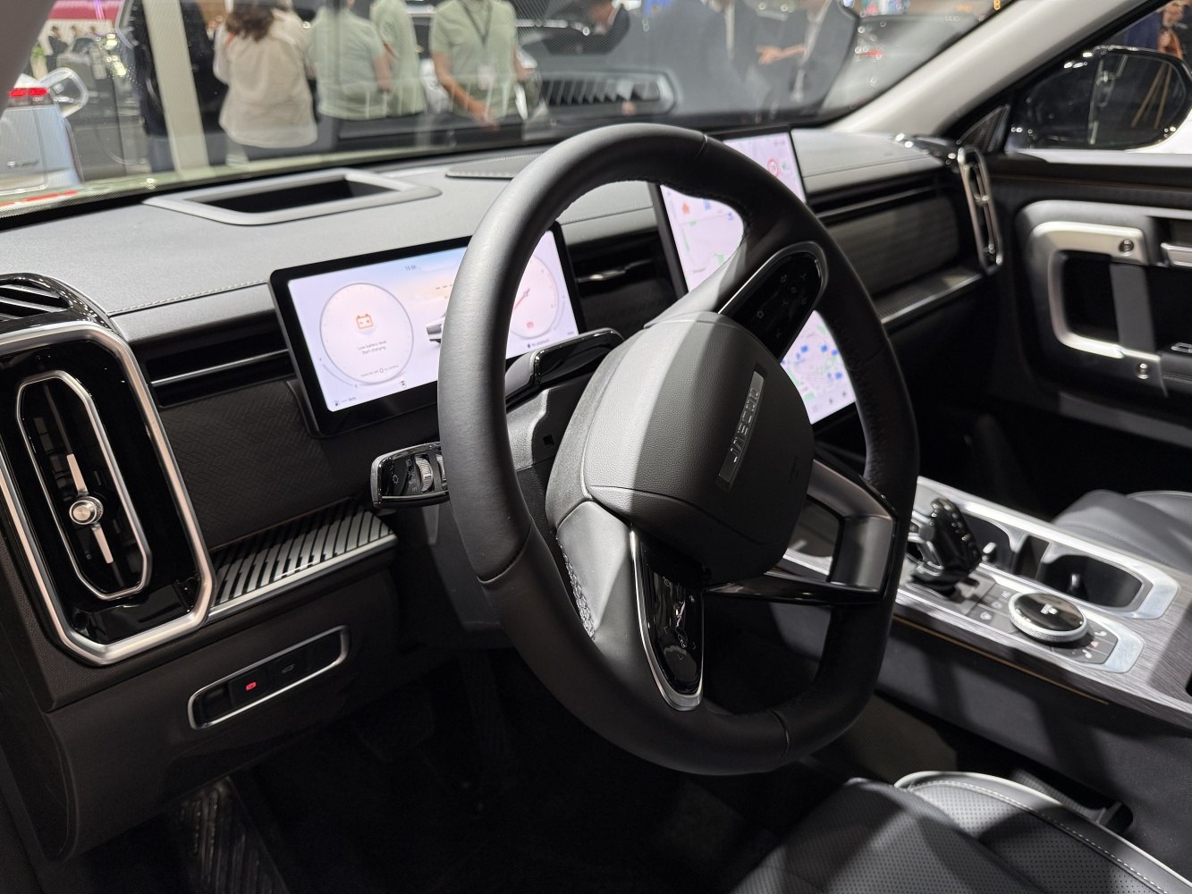 Digital instrument cluster and modern steering wheel design in car interior