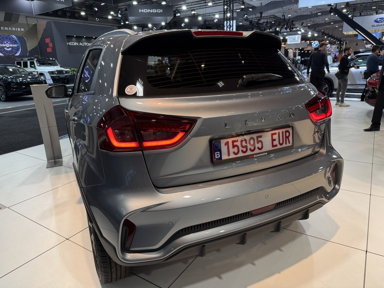 Rear view with illuminated LED tail lights of a sleek modern SUV