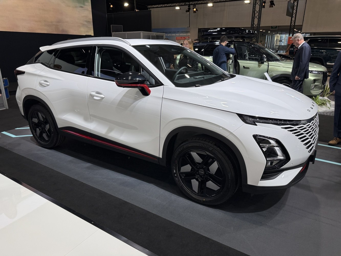 Sleek side profile with black alloy wheels and aerodynamic design