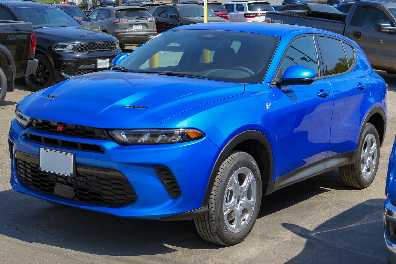 Blue compact SUV with prominent front grille and sleek headlights