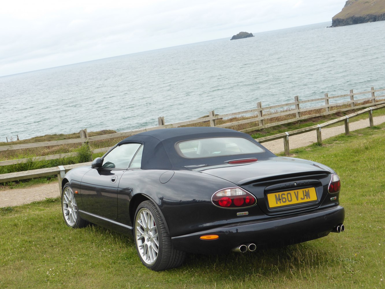 Rear view of a convertible with soft top and distinct tail lights