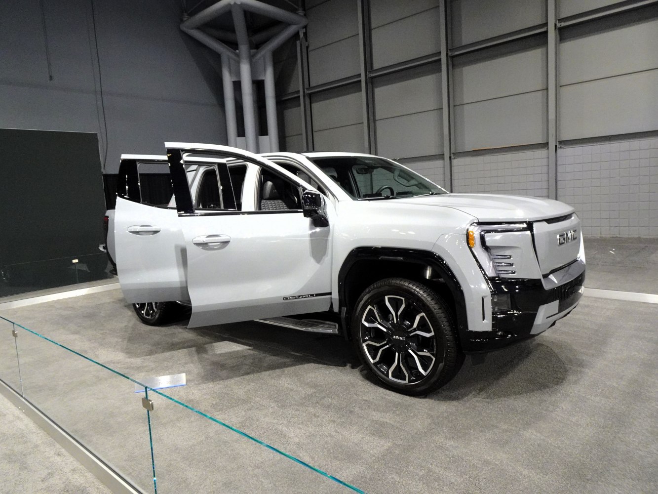 Electric crew cab pickup with LED headlights and open doors