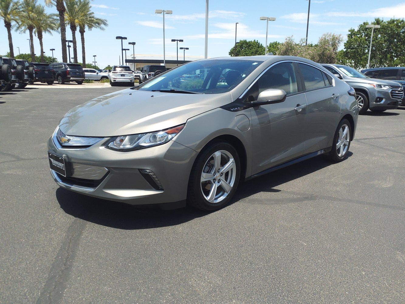 Front-side view of an electric sedan with aerodynamic body lines and alloy wheels