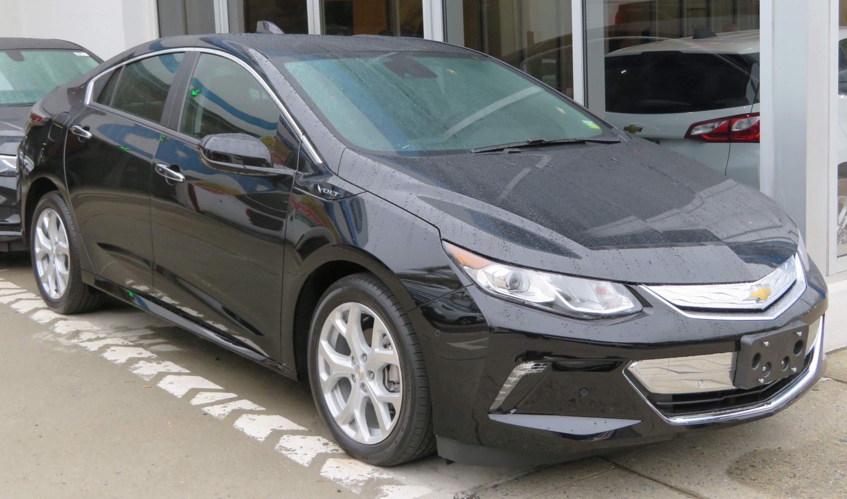 Black aerodynamic hybrid hatchback with alloy wheels
